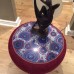Glass topped burgundy side table