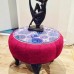 Glass topped burgundy side table